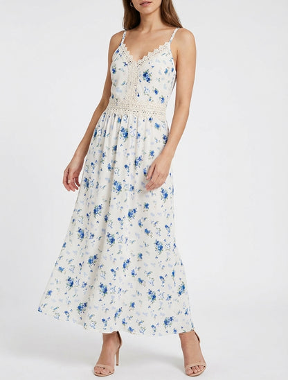 Lange jurk met kleine bloemenprint en haakdetails. - Blauw